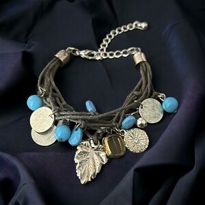 Multi strand cord charm bracelet